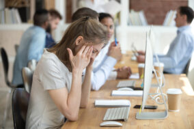 female-employee-having-health-problems-at-workplace