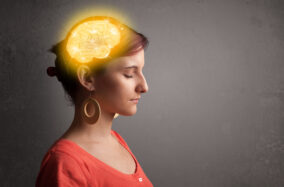 young-girl-thinking-with-glowing-brain-illustration